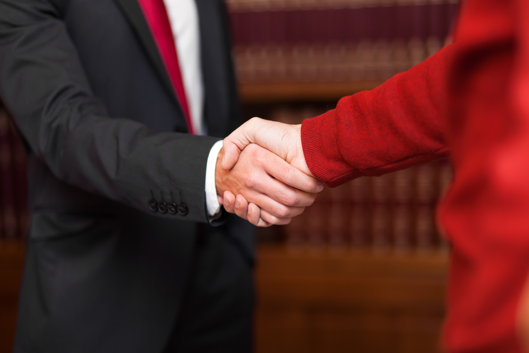 gentleman and woman shaking hands