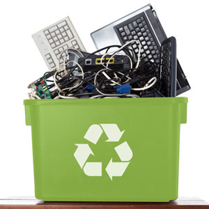 keyboards inside of a recycling bin