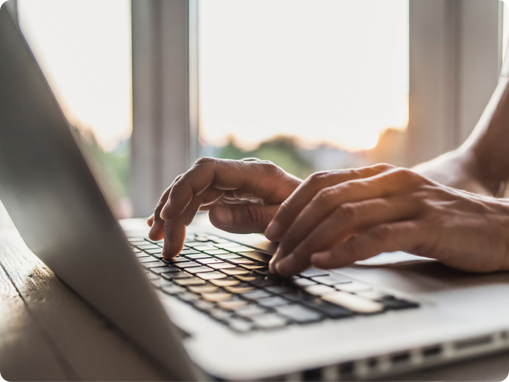 woman typing on laptop