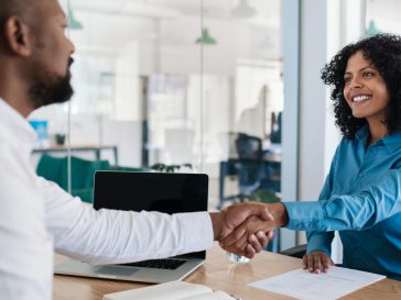 gentleman and woman shaking hands