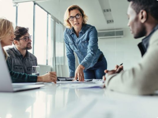 group of people having a meeting in a office