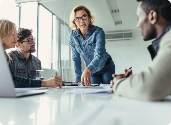 group of people having a meeting in a office