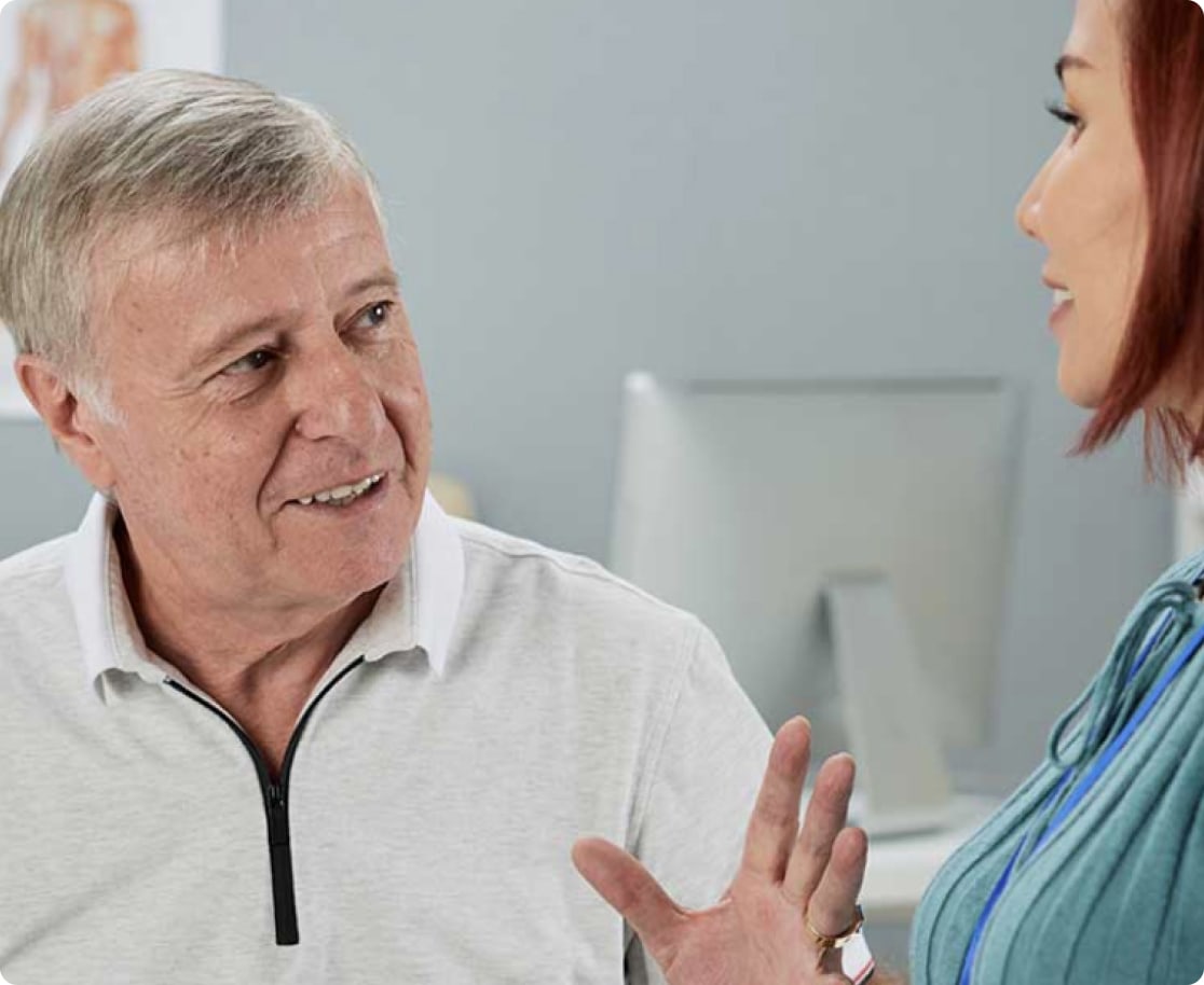 elder man talking to nurse