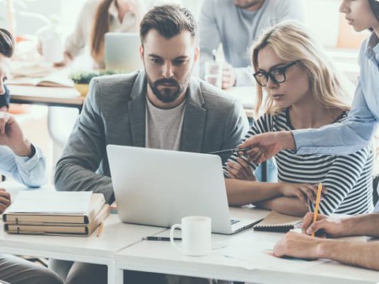 IT Staff going over information on computer