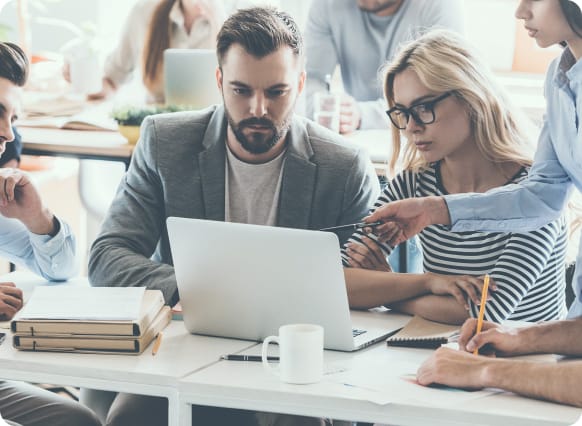 IT Staff going over information on computer