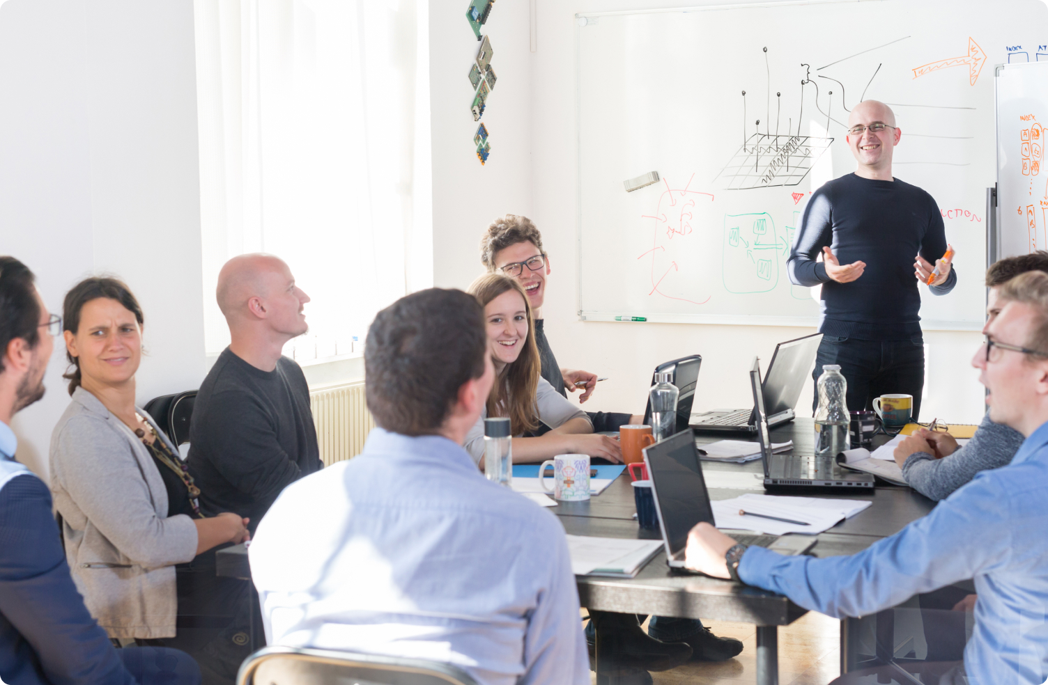 group of coworkers having a meeting in conference room