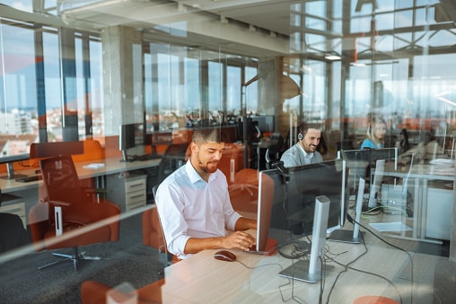 close-up of gentleman working on computer