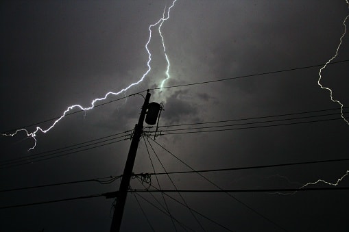 lighting bolt hitting electric pole