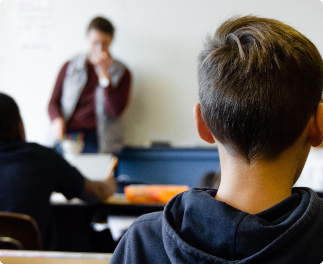 kid sitting in classroom learning