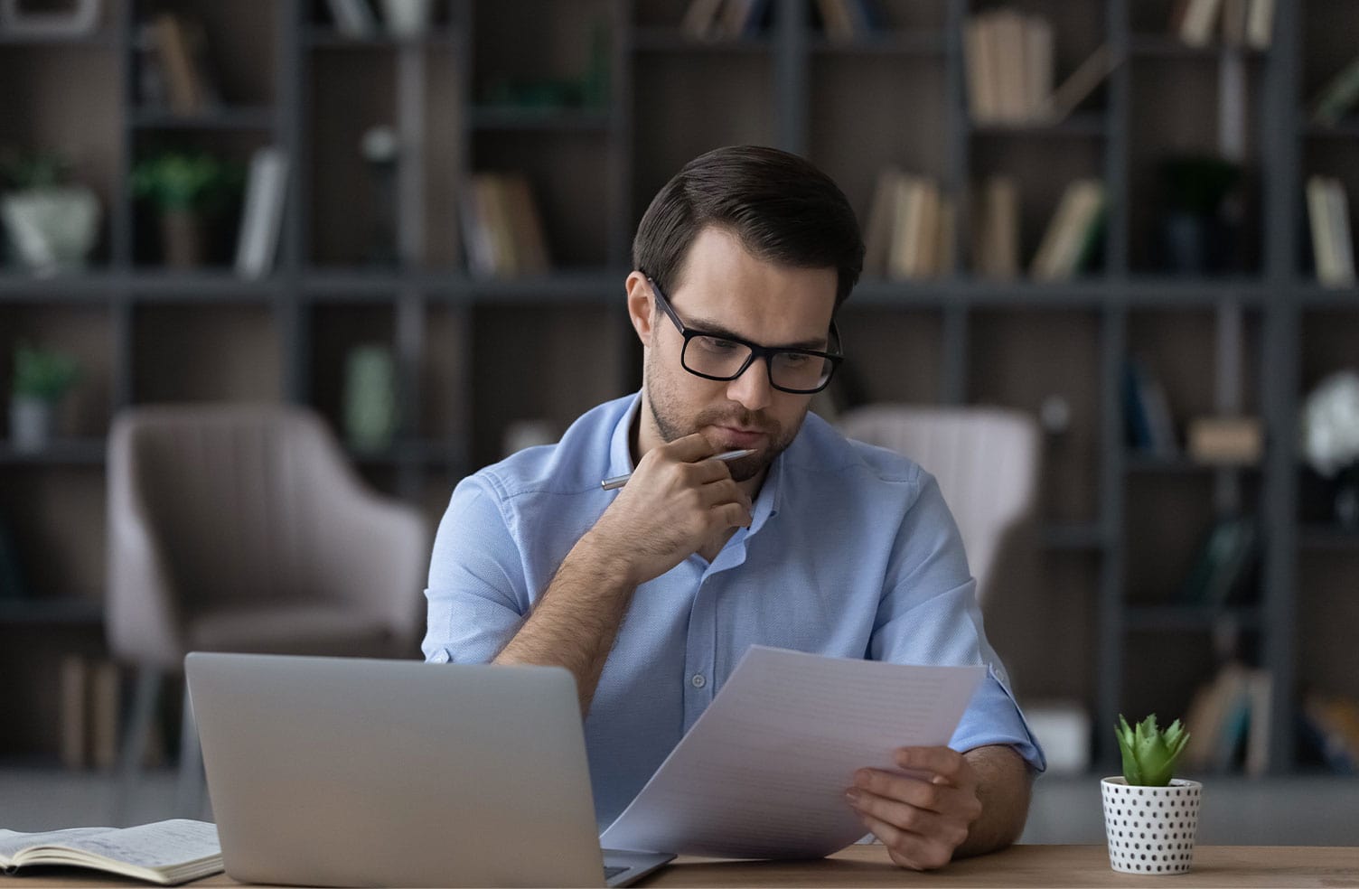 employee reviewing cyber insurance policy