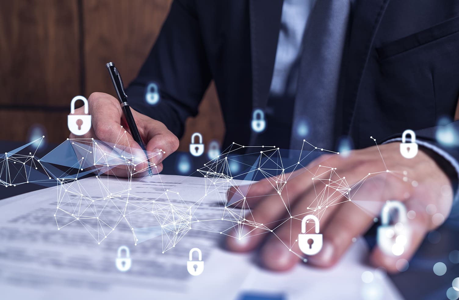 a businessman signing cyber insurance papers